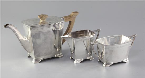 A 1930s silver three piece tea set by Stower & Wragg, gross 42.4oz.